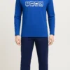Men’s bright blue cotton pajama set with “Eat Sleep Ride Repeat” graphic and navy pants